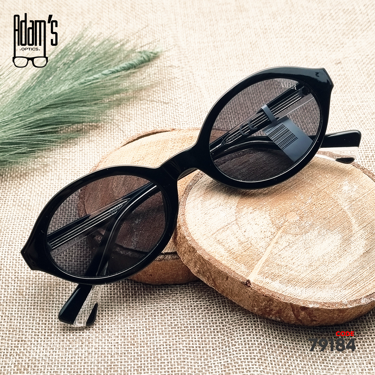 Black oval Amber 98119 sunglasses with dark black tinted lenses