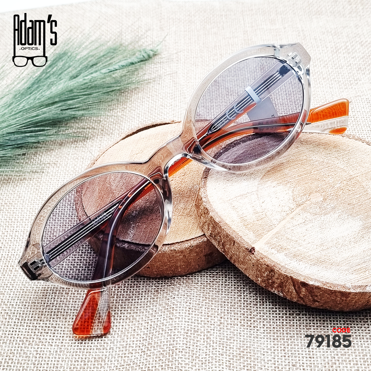 Transparent brown oval Amber 98119 sunglasses with clear grey tinted lenses