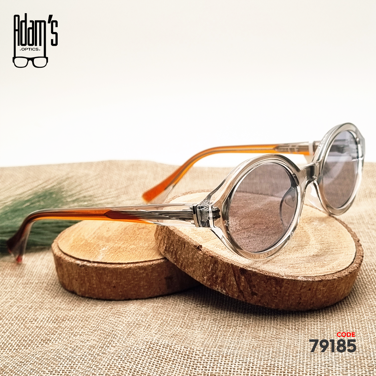 Transparent brown oval Amber 98119 sunglasses with clear grey tinted lenses