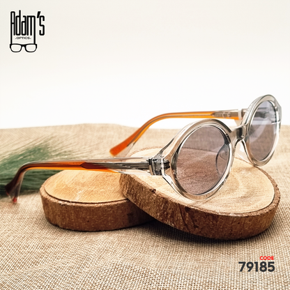 Transparent brown oval Amber 98119 sunglasses with clear grey tinted lenses